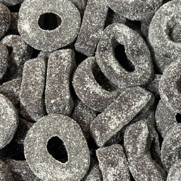 Black aniseed ring lollies coated in sugar