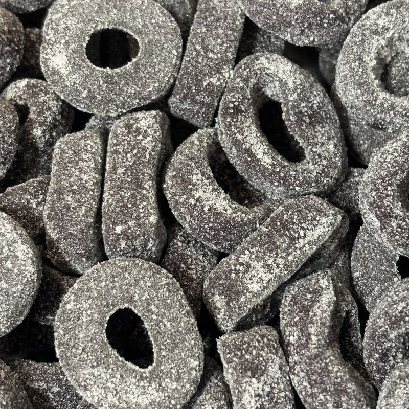 Black aniseed ring lollies coated in sugar