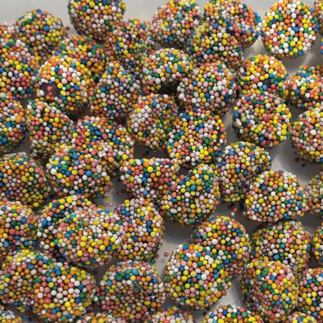 Dome shaped aniseed lollies coated in colourful hundreds and thousands