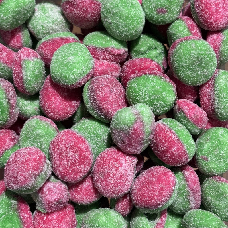 Pink and green crumbly lollies with apple flavour