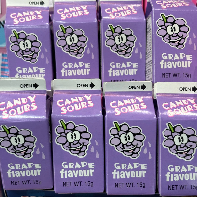 Small sour grape flavour candy balls in a mini milk carton