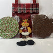 Red Christmas gift bag with Reindeer design, containing a large Christmas chocolate freckle or milk chocolate Santa.