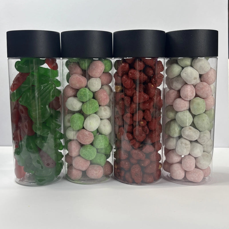 Four clear Christmas lolly tubes with black lids, filled with red and green frogs, colourful sugared peanuts and assorted bon bons.