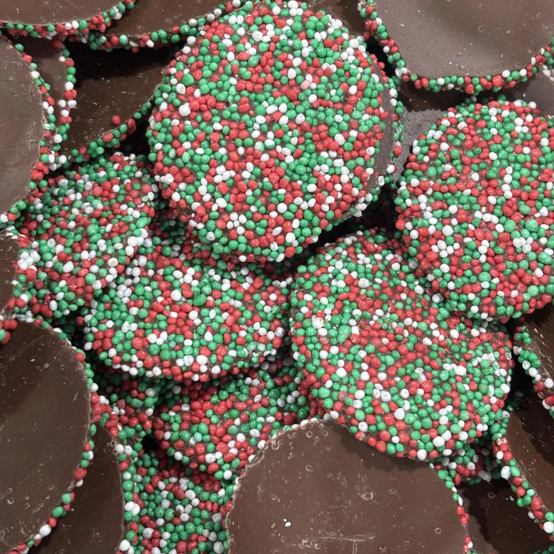 Round milk chocolate speckles generously coated with crunchy red, green and white candy sprinkles.