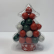 Clear Christmas tree-shaped container filled with red, green and white candy-coated peppermint chocolate balls and Jaffas.