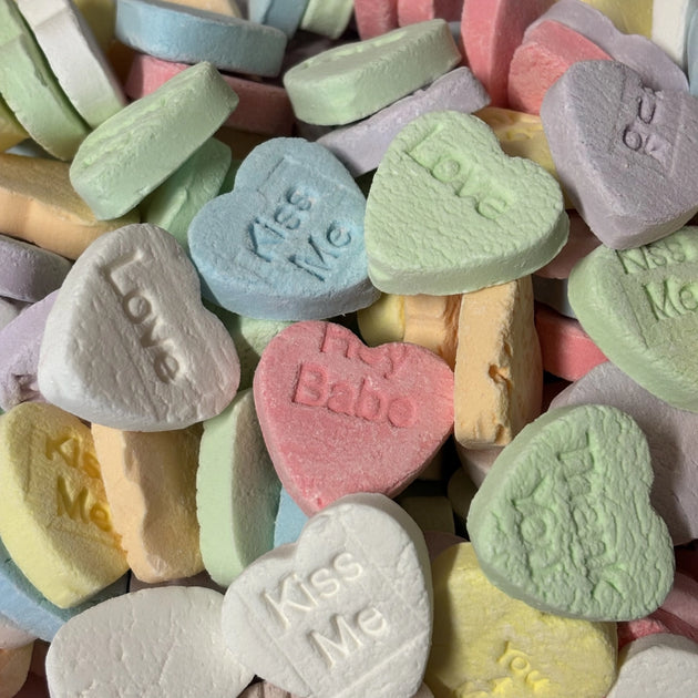 Assorted colourful conversation heart lollies with printed messages