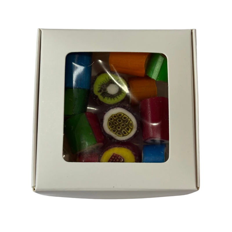 A square gift box with a clear plastic window showing fruit rock candy inside.