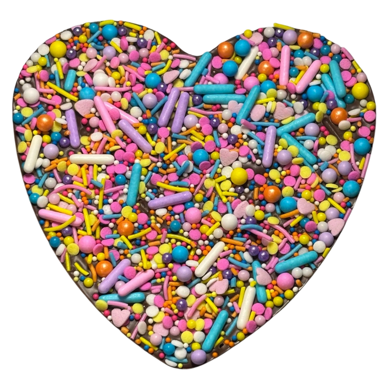 Heart shaped chocolate with pastel colour sprinkles