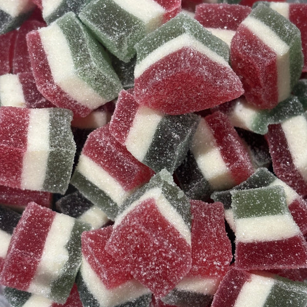 Soft and chewy Christmas jellies with red, white and green layers, coated in sugar crystals.