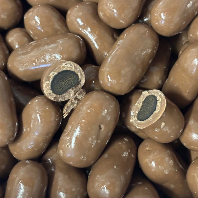 Thick pieces of licorice coated in milk chocolate