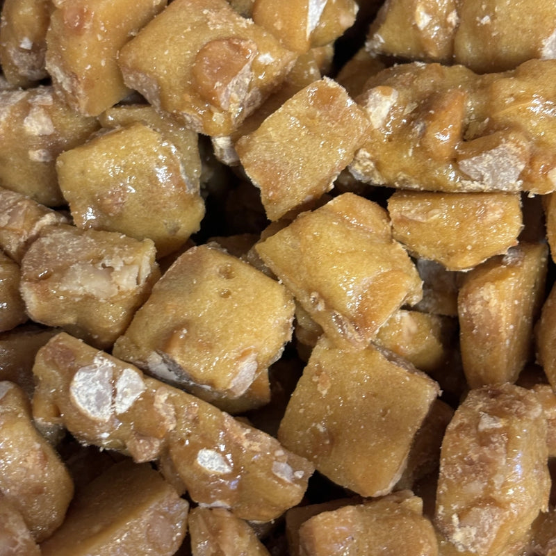 Macadamia nuts coated in caramelised toffee