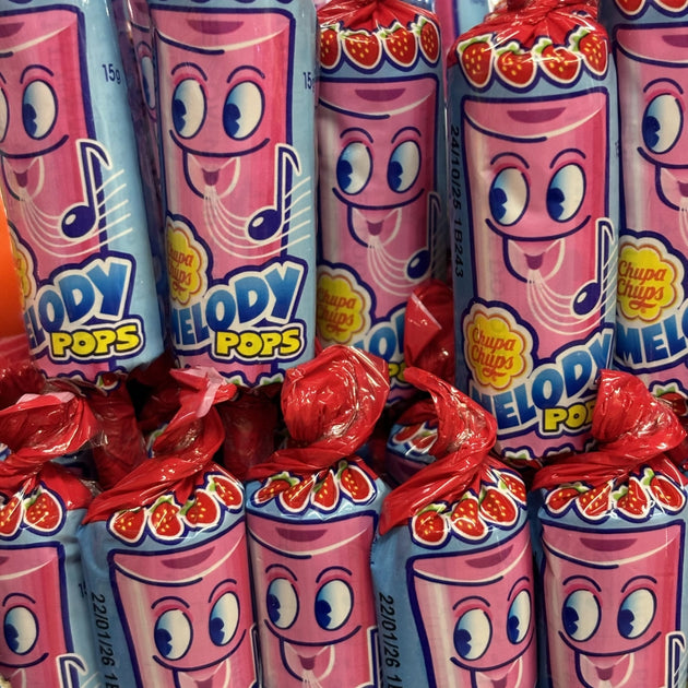 Pink strawberry lollipop with a whistle