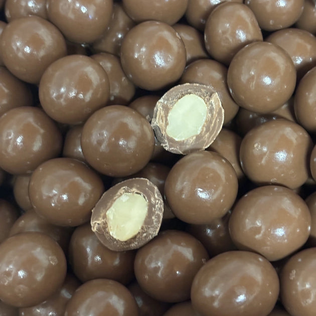 Macadamia nuts coated in milk chocolate