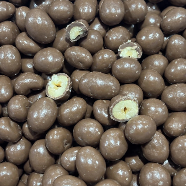 Pile of peanuts coated in milk chocolate