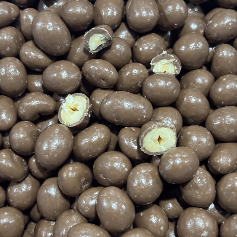 Pile of peanuts coated in milk chocolate