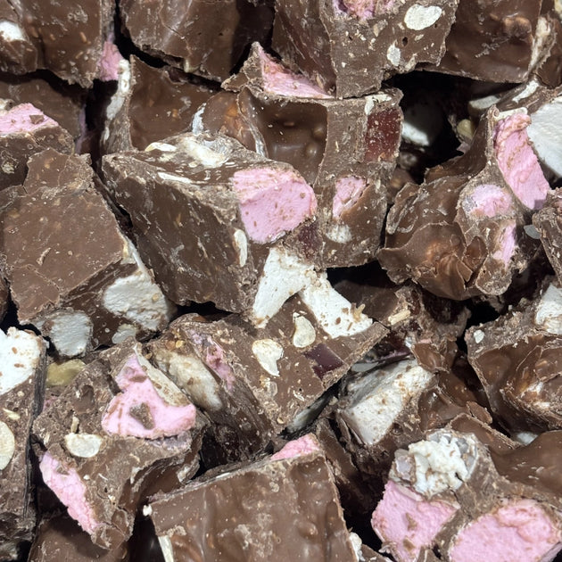 Pieces of milk chocolate rocky road with marshmallows and nuts