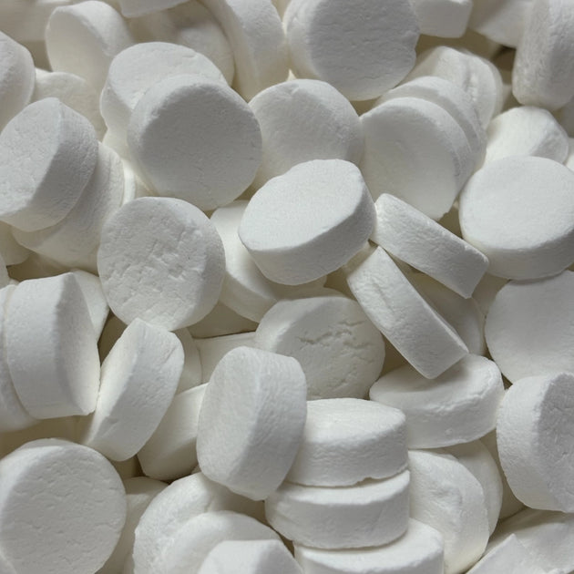 Round white, peppermint flavoured lollies