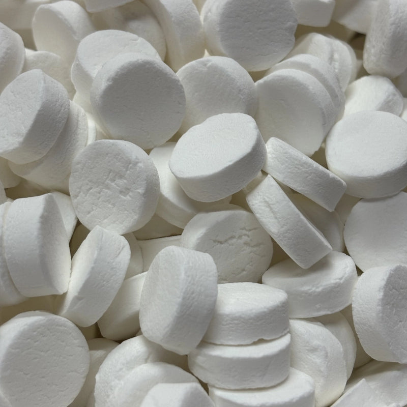 Round white, peppermint flavoured lollies