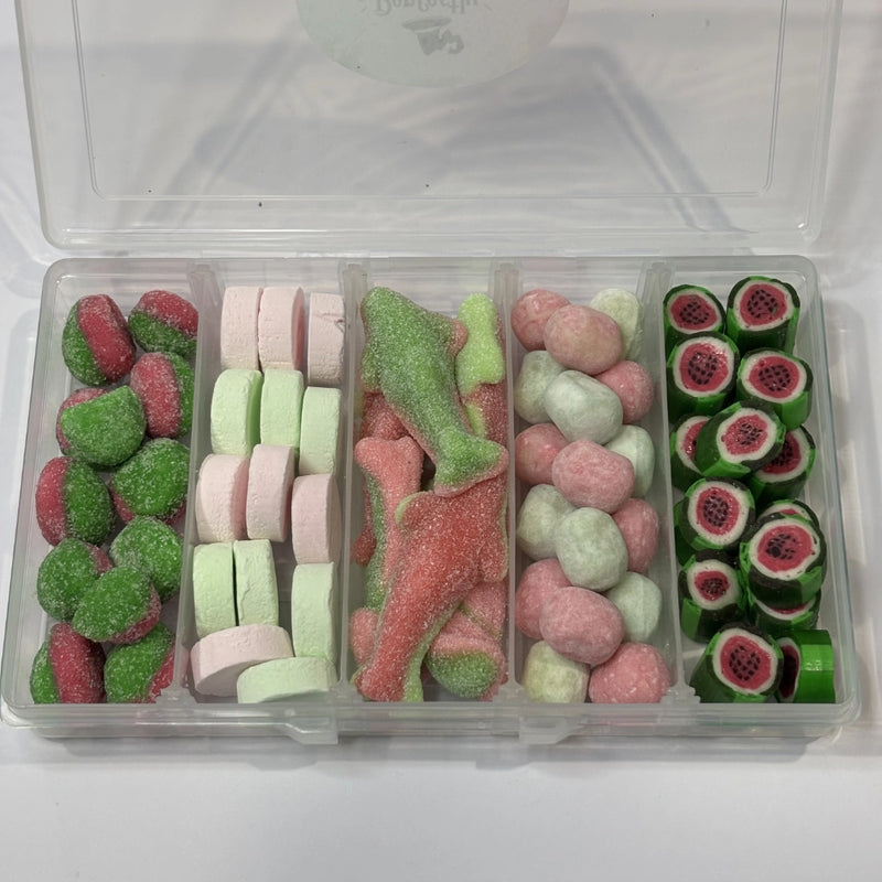 A wicked lolly box with pink and green lollies