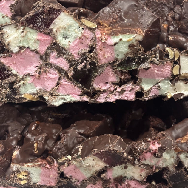 Rocky road with marshmallows, lollies and nuts coated in dark chocolate