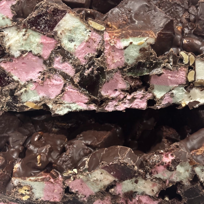Rocky road with marshmallows, lollies and nuts coated in dark chocolate
