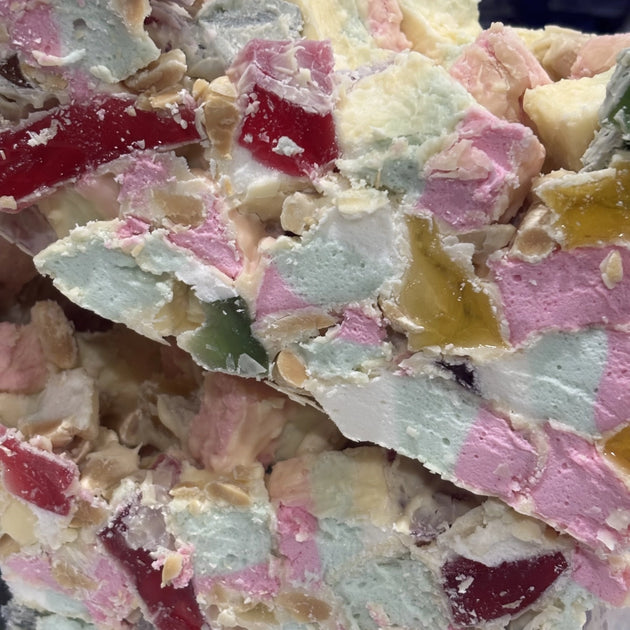 Rocky road with marshmallows, lollies and nuts coated in white chocolate