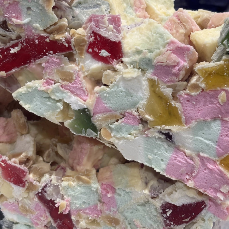 Rocky road with marshmallows, lollies and nuts coated in white chocolate
