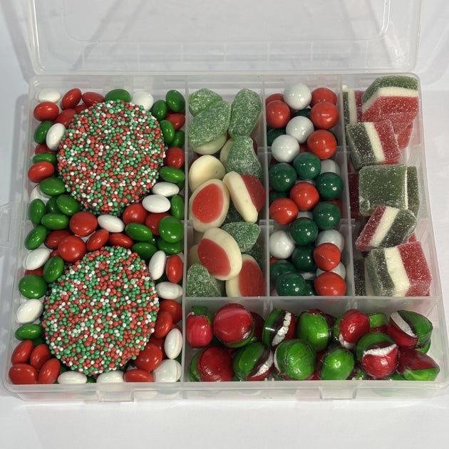 Santa's Treat Box filled with red, green and white Christmas confectionery, including chocolate speckles, chocolate buttons, strawberries & cream, spearmint leaves, peppermint chocolate balls, Jaffas, jolly jellies and toffee apple sweets.