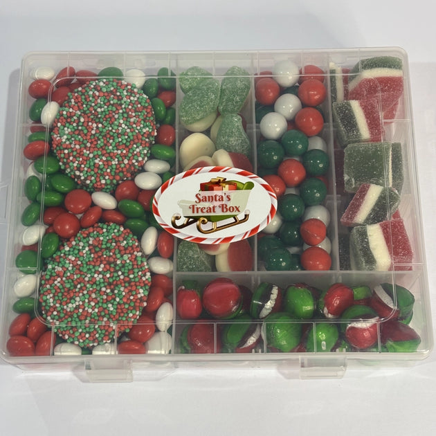 Clear compartment-style Santa's Treat Box filled with red, green and white Christmas confectionery, including chocolate speckles, chocolate buttons, strawberries & cream, spearmint leaves, peppermint chocolate balls, Jaffas, jolly jellies and toffee apple sweets.