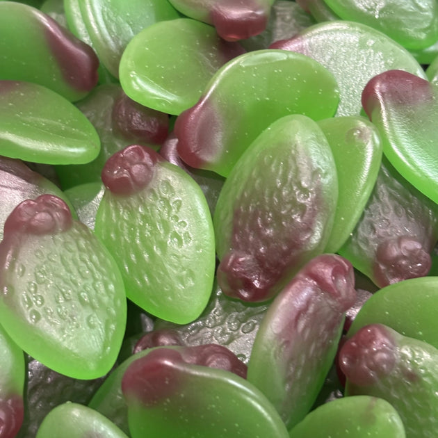 Green and purple sour feijoa-shaped gummy lollies