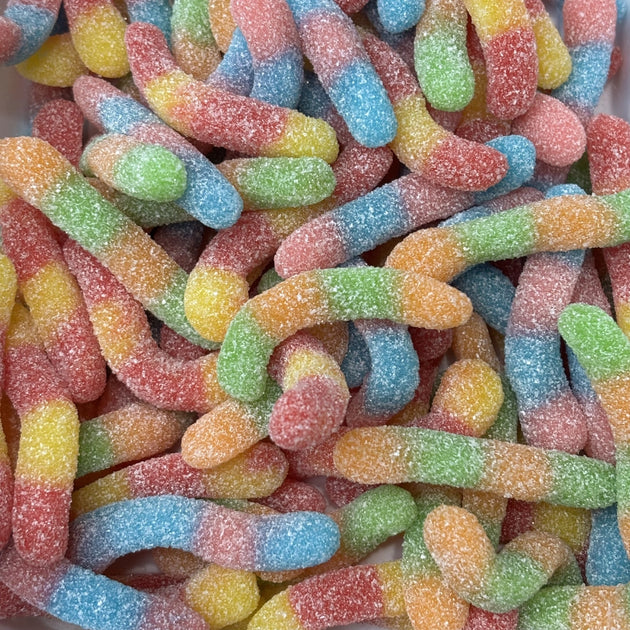 Colourful worm lollies dusted in sour sugar