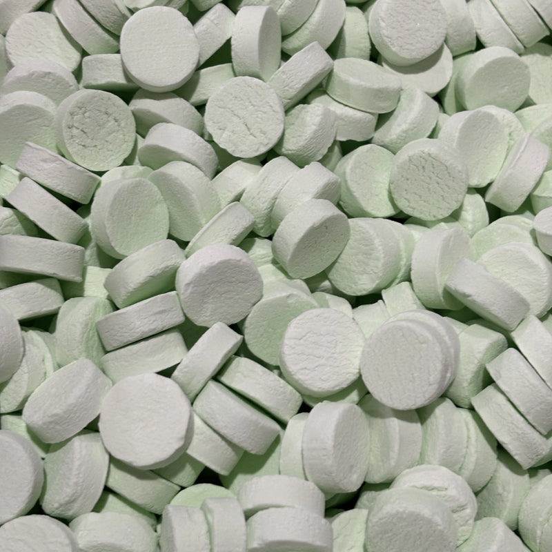 Round green spearmint flavour hard lollies