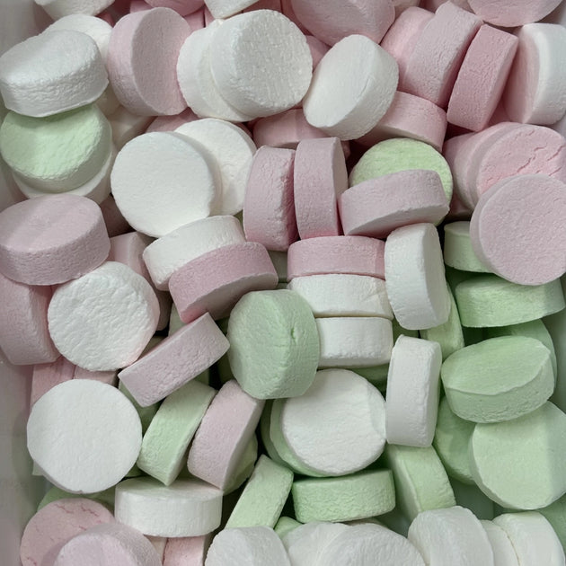 Round pink musk, white peppermint and green spearmint button lollies