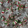 Individually wrapped Starlight Mints featuring red, green and white peppermint swirls in traditional round boiled sweets.