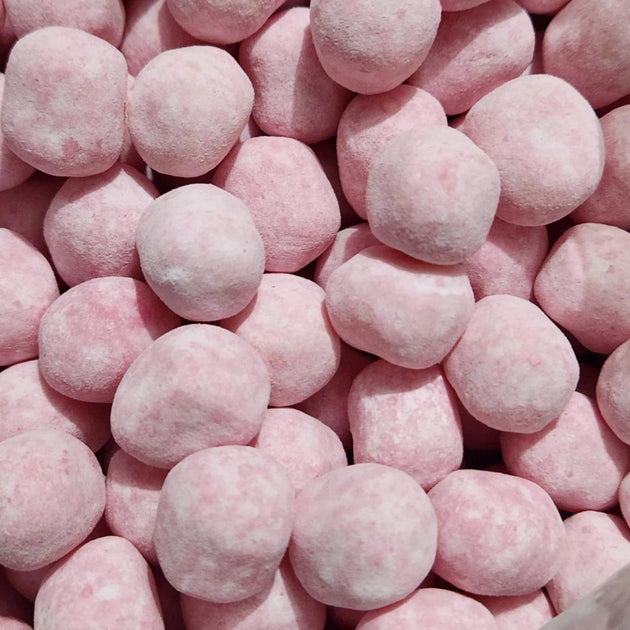 Chewy strawberry bon bon lolly that has a light dusting of powder