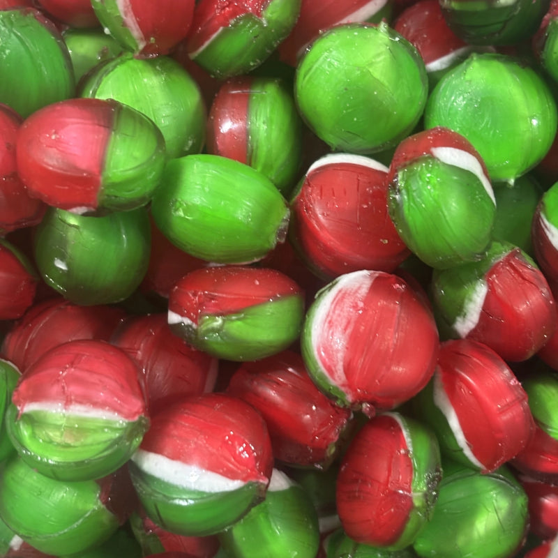 Round green and red boiled lollies with toffee apple flavour