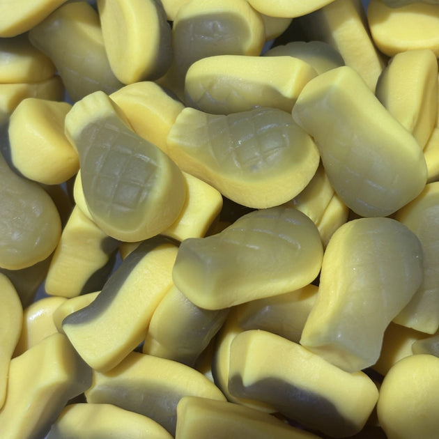 Vegan pineapple-shaped lollies with a yellow and green design.